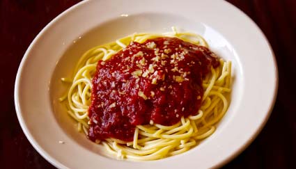 A plate of spaghetti with tomato sauce and cheese, served at a restaurant in Idaho.