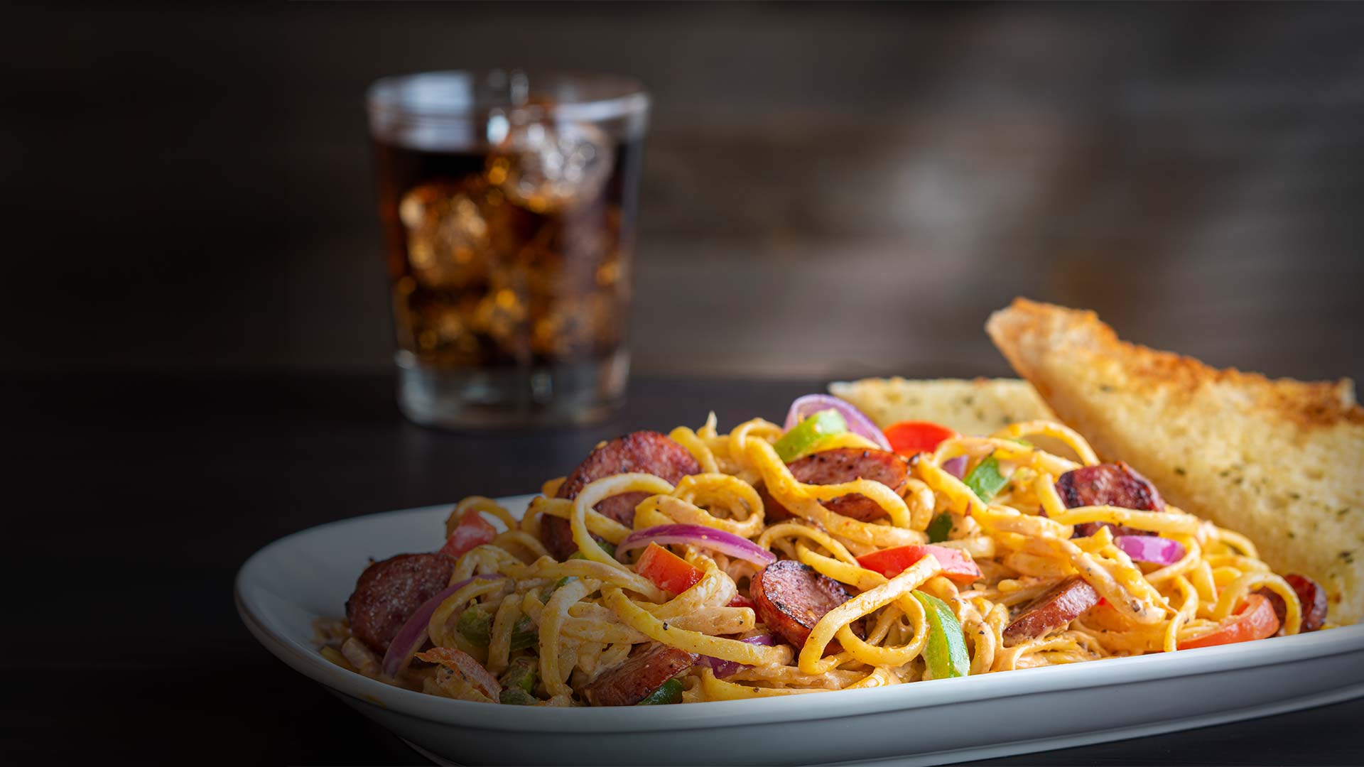 Pasta noodles, garlic bread and sausages served at Smoky Mountain Pizzeria & Grill in Idaho.