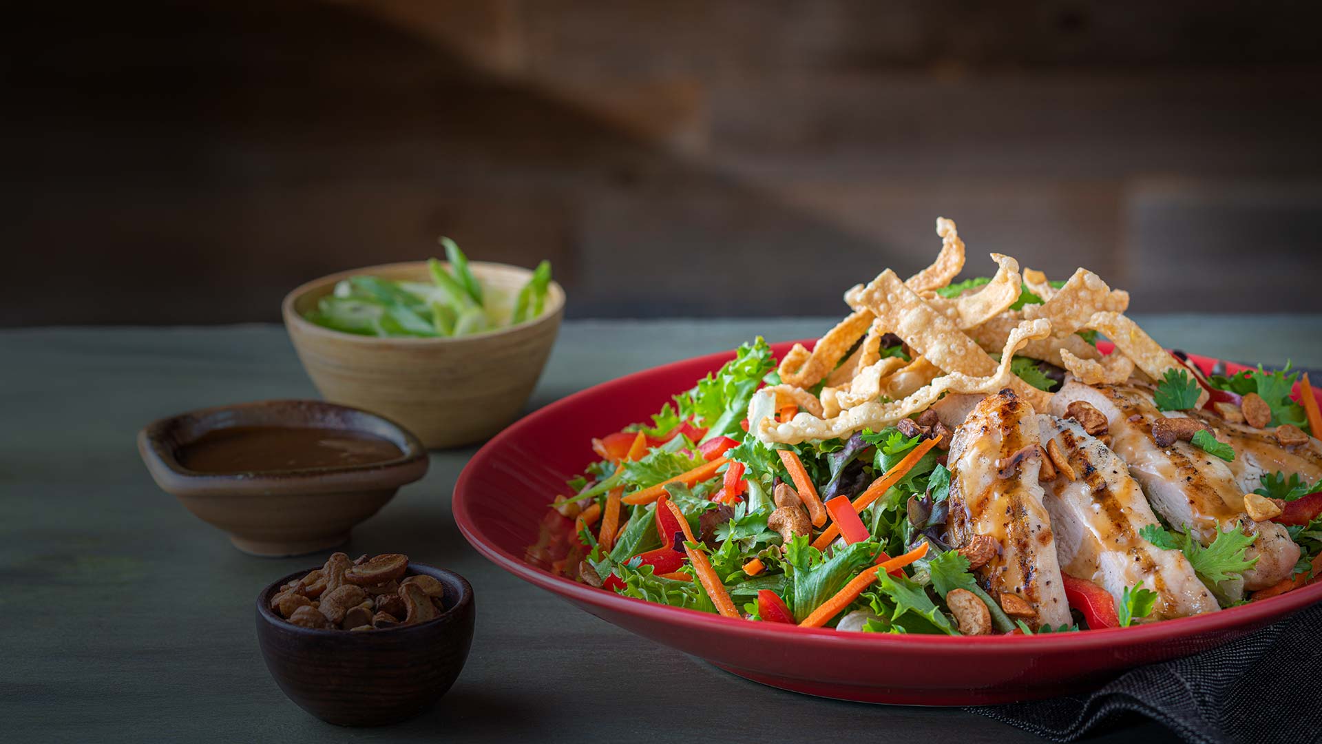 Garden Fresh Salad topped with sliced and grilled chicken served at Smoky Mountain Pizzeria & Grill in Idaho.