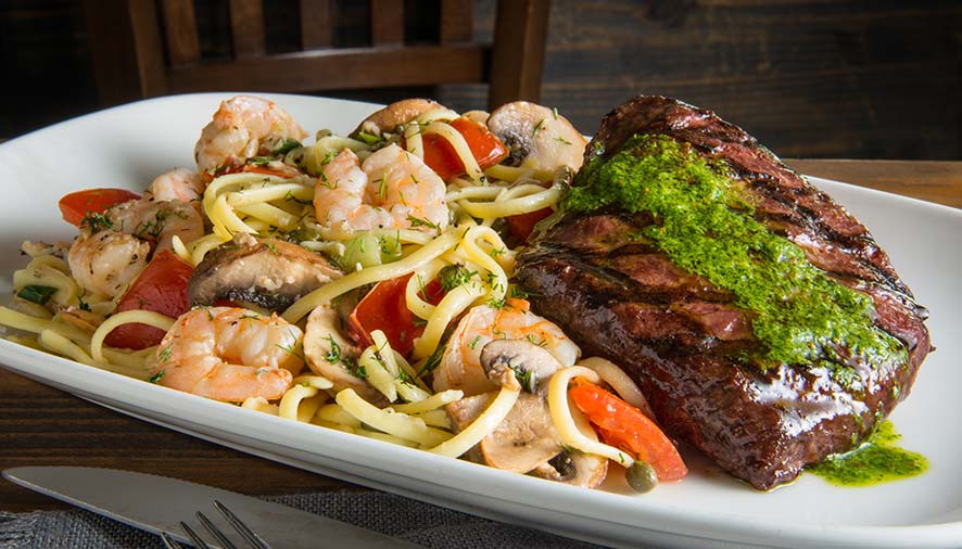 Grilled steak with green sauce, shrimp pasta with vegetables at our Idaho restaurant.