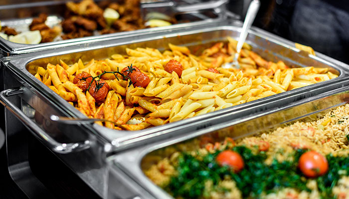 Buffet tray with penne pasta and cherry tomatoes, perfect for Catering Idaho events.
